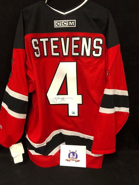 SCOTT STEVENS SIGNED DEVILS JERSEY W/ AJ SPORTSWORLD COA