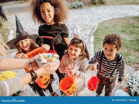 Children in Halloween Costumes, Trick or Treating Stock Photo - Image ...