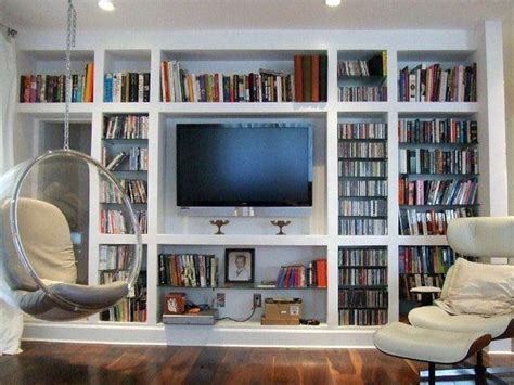 Home Design Ideas: Television Wall with Built-In White Painted Bookcases