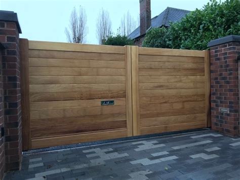 Iroko double gates in knutsford design in light oak finish | Wooden gates driveway, Sliding ...