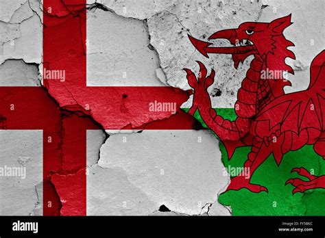 flags of England and Wales painted on cracked wall Stock Photo - Alamy