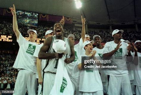 Mateen Cleaves of Michigan State celebrates with his teammates after... News Photo - Getty Images