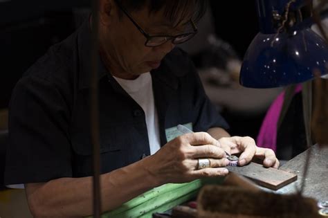 Premium Photo | Thai jeweler making fine jewelry in a workshop