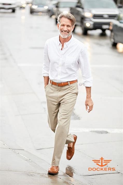 Khaki pants and a white button-up shirt are an iconic menswear combination. What keeps this loo ...