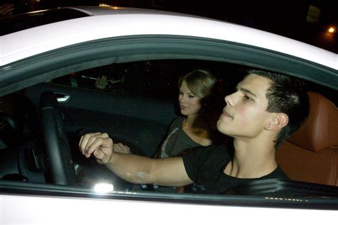 Taylor Lautner and Taylor Swift cruise in an Audi R8 sports car