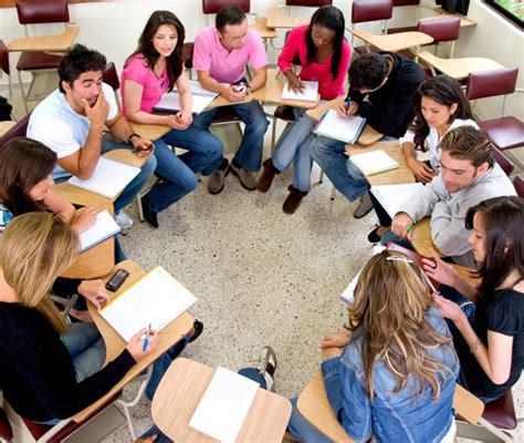 Students sit around talking together Stock Photo free download