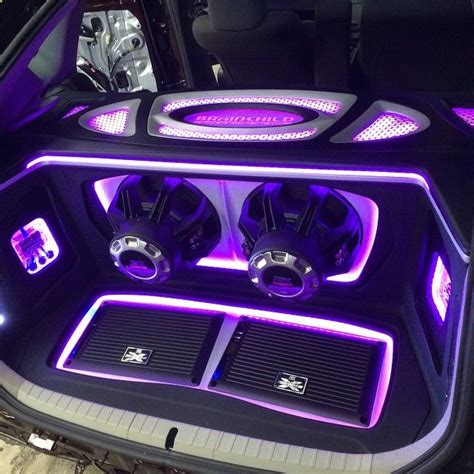 XThunder amplifiers recessed into a false floor and 75 series subwoofers in this custom trunk ...
