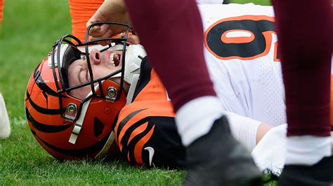 Joe Burrow injury: Bengals quarterback carted off after hit to knee