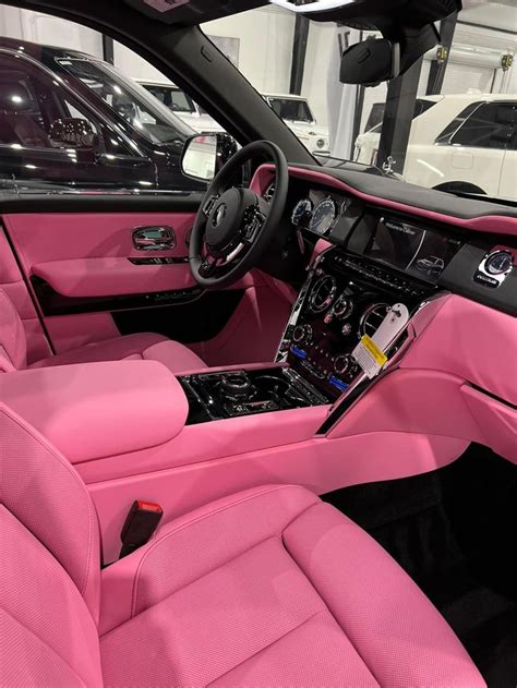 the interior of a car with pink leather