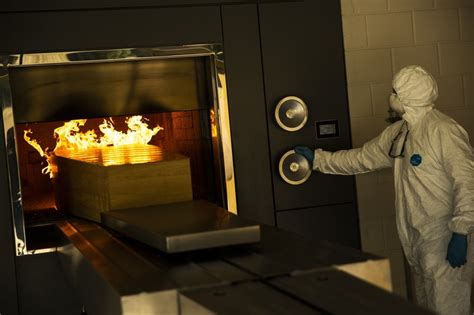 A Worker Moves A Casket Of A COVID 19 Deceased Into The Crematorium Oven At The Pontes ...