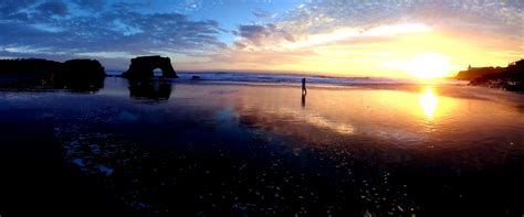 The sunset at Natural Bridges State Beach, California. : r/pics