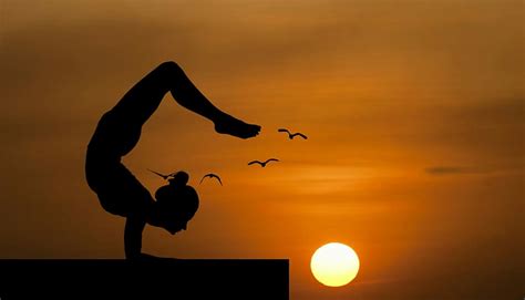 HD wallpaper: Woman doing an acrobatic yoga pose, silhouetted against sunset. | Wallpaper Flare