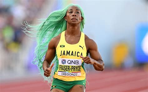 Shelly-Ann Fraser-Pryce adjusts her wig during 200m heats