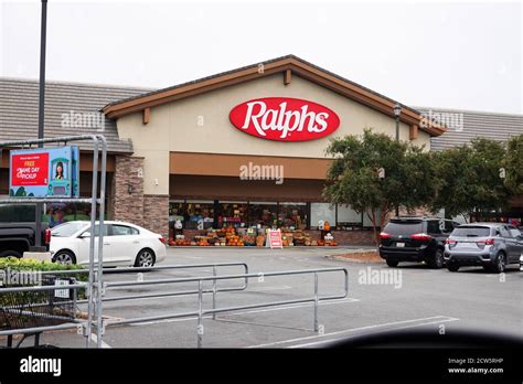 Parking lot for Ralphs grocery store storefront with company logo displaying Halloween goods ...