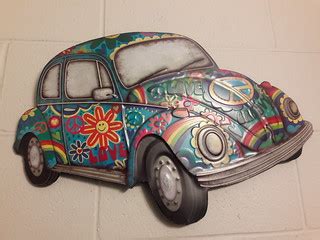 Metal embossed wall decor of a hippy VW bug from the 1960'… | Flickr