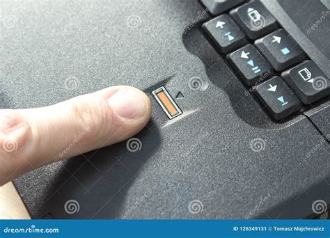 The Man Puts an Index Finger at the Fingerprint Reader on the Laptop ...