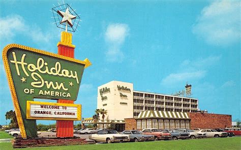 transpress nz: cars outside the Holiday Inn, Orange, California, late 1960s