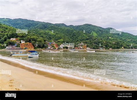 Panoramic shot of water taxi boats and houses at the beach town of ...