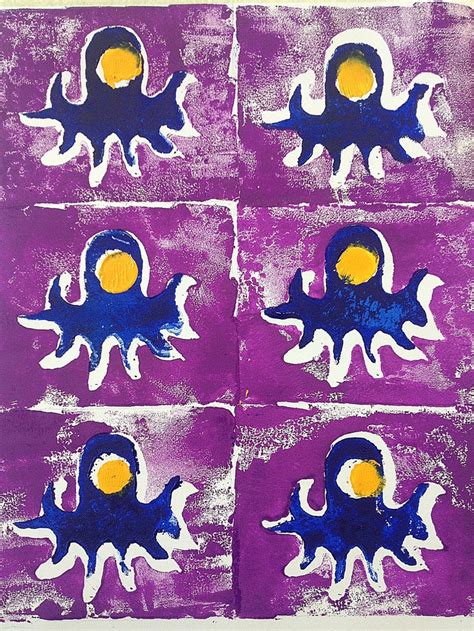 four purple and blue paintings with yellow dots on them