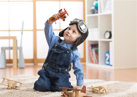 Boy Playing With Action Figures