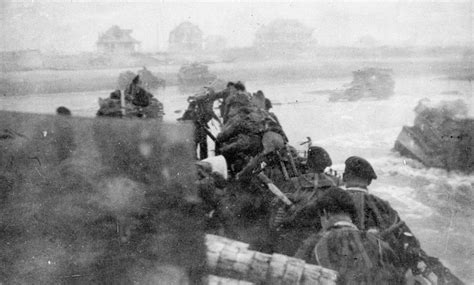 British troops wading ashore from landing craft, Sword Beach, 6 June ...