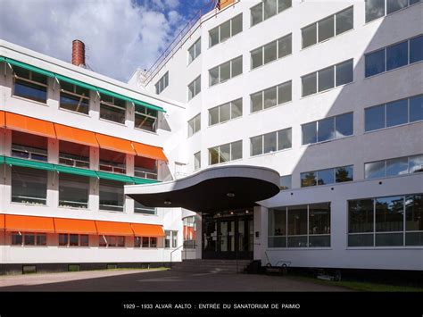 an orange and white building with many windows