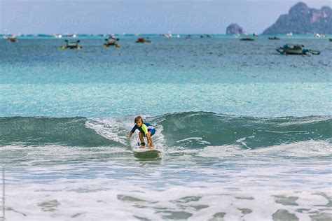 little boy surfing small waves in indonesia by Akela - from alp to alp - Indonesia, Surfing ...