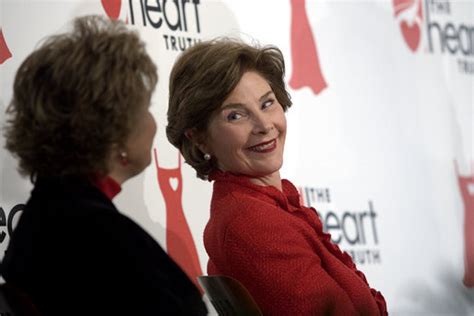 Laura Bush sits with Lois Ingland, a heart disease survivor, during an ...