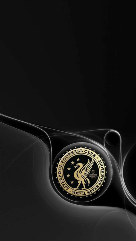 a black and gold wallpaper with an emblem on it