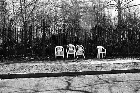 chairs against cemetery fence | Nesster | Flickr