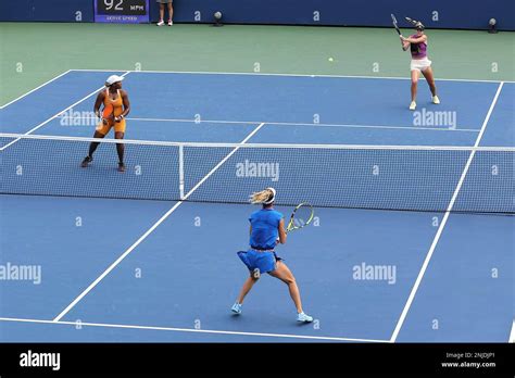 Caty McNally returns during a women's doubles match at the 2022 US Open, Monday, Sep. 5, 2022 in ...