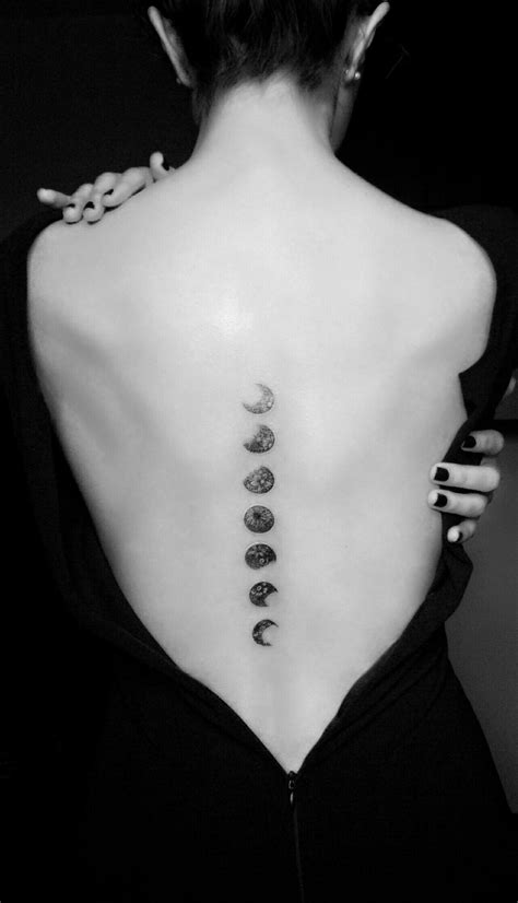 Celestial Beauty: Moon Phases Floral Spine Tattoo