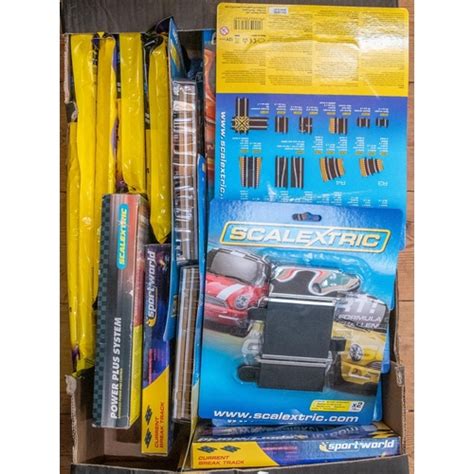 A large quantity of Scalextric track packs and accessories. Includes Scalextric digital lap counter,