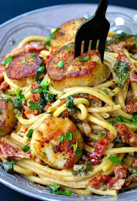 scallops and spinach over pasta