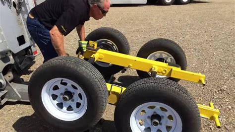 Invention used for towing storage containers, I think this could be adapted for our use ...