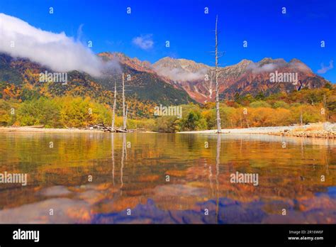 Taisho pond in autumn and Hodaka mountain range Stock Photo - Alamy