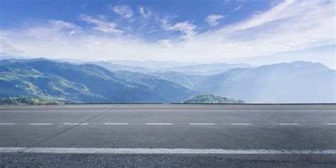 Premium Photo | Empty highway asphalt road and beautiful sky | Asphalt road, Mountain landscape ...