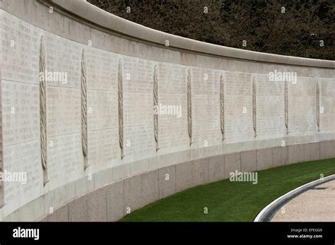 Names of fallen WWII soldiers carved in a long wall at the American ...