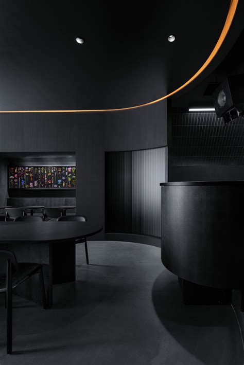 Snøhetta designs Tokyo restaurant with all-black interior and stage ...