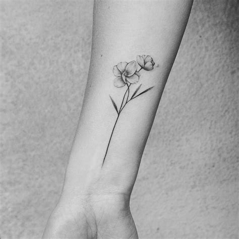 wrist tattoo girls #wristtattooidea | Flower wrist tattoos, Wrist tattoos girls, Orchid tattoo