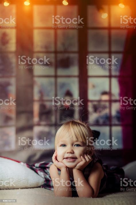 Portrait Of Cute Girl Lying Barefoot In The Bed Stock Photo - Download Image Now - Barefoot, Bed ...