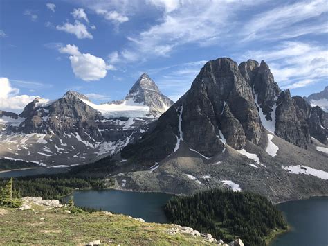 Mount Assiniboine in the distance, as seen from the Nublet trail near Lake Magog, in Alberta ...