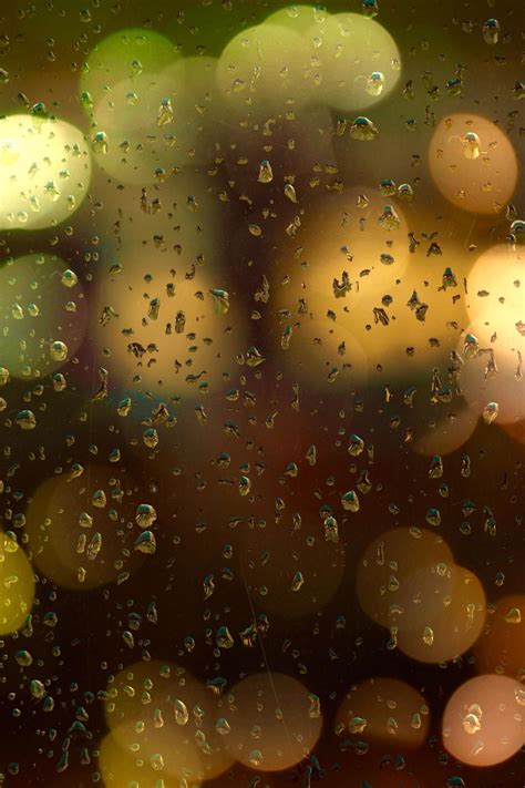 Raindrops and bokeh lights on the window 2281713 Stock Photo at Vecteezy