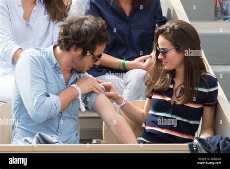 Vianney and his girlfriend Catherine Robert in stands during French ...