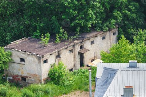 Urban landscape with old warehouse and green trees in summer Kaunas ...