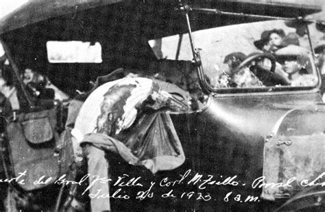 an old black and white photo of people in a car