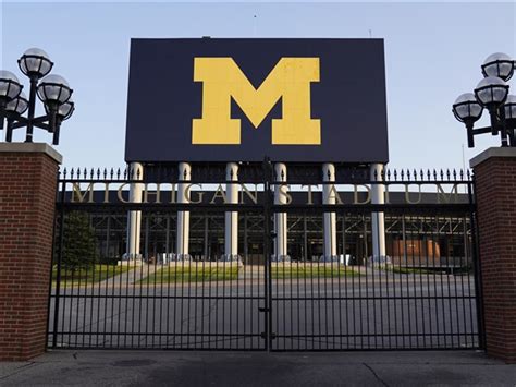 University of Michigan athletic department eliminating 21 positions ...