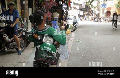 Vietnam motorcycle taxi driver Stock Videos & Footage - HD and 4K Video Clips - Alamy