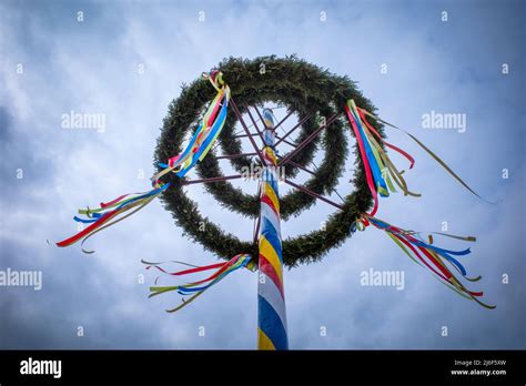 a maypole decorated with colorful ribbons Stock Photo - Alamy