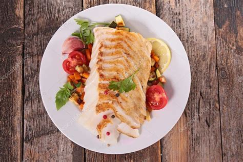 Grilled fish fillet — Stock Photo © studioM #127224562